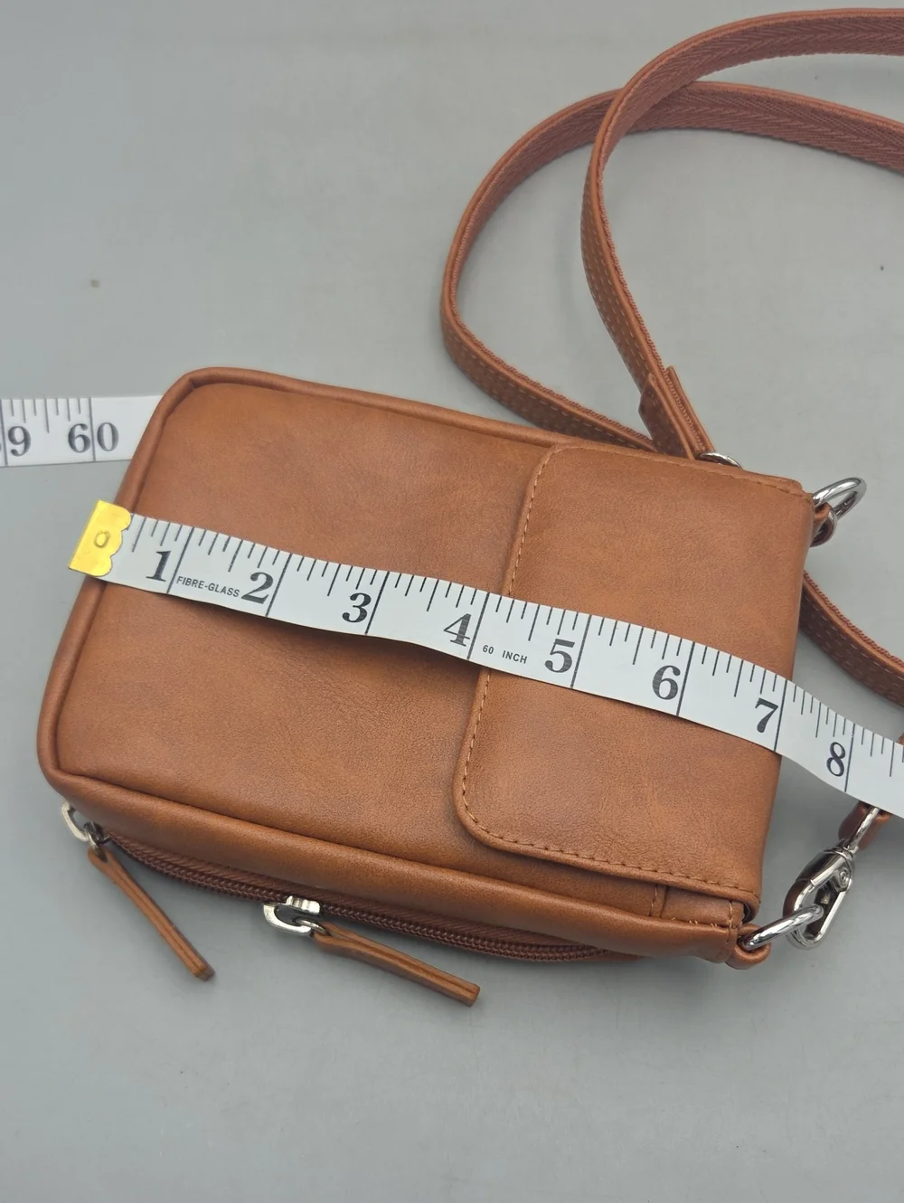 Hammacher Schlemmer • Wearable crossbody leather wallet